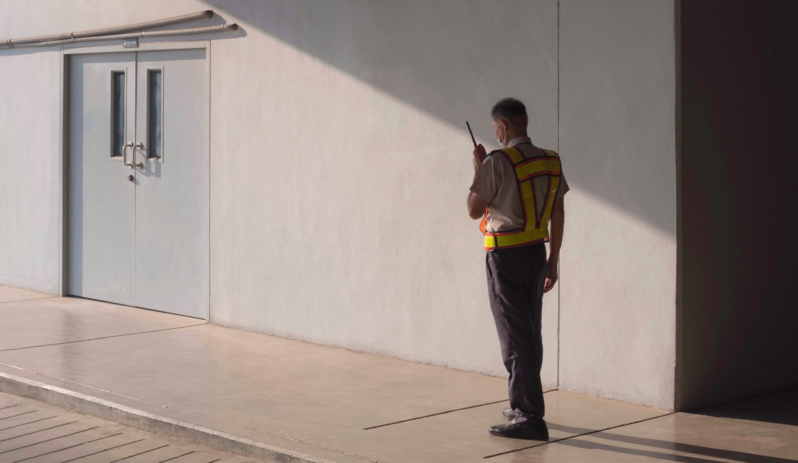 security-guard-using-walkie-talkie-while-working-i-2022-11-04-00-19-45-utc