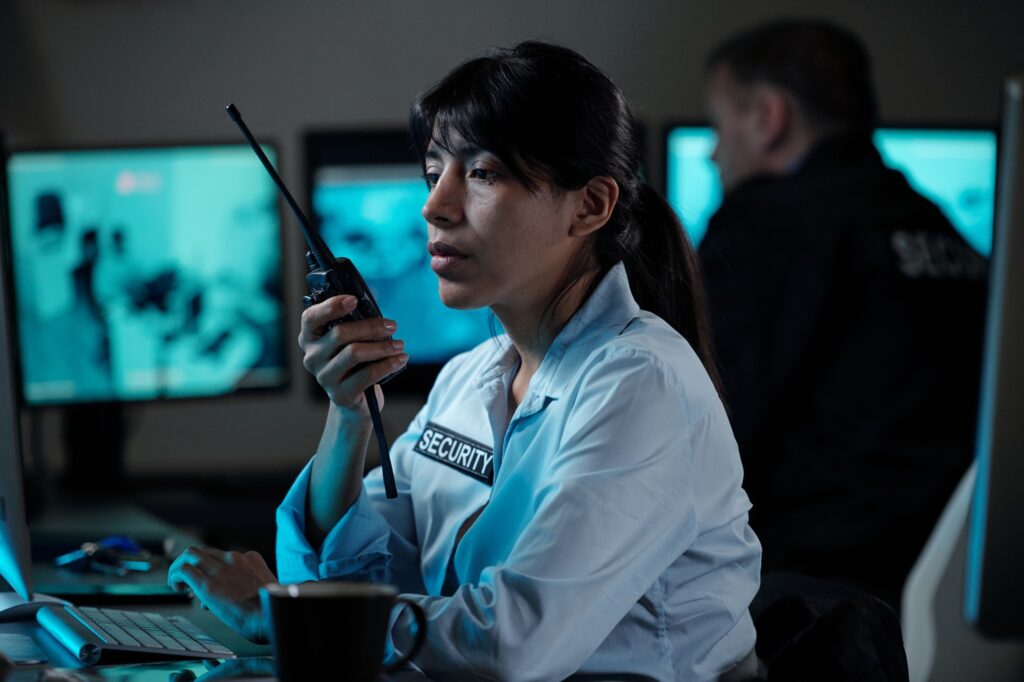 Security guard using walkie-talkie