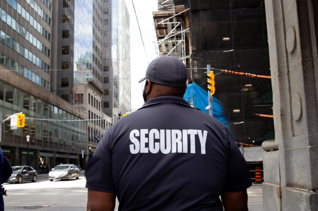 Security guard in uniform patrolling a residential area.